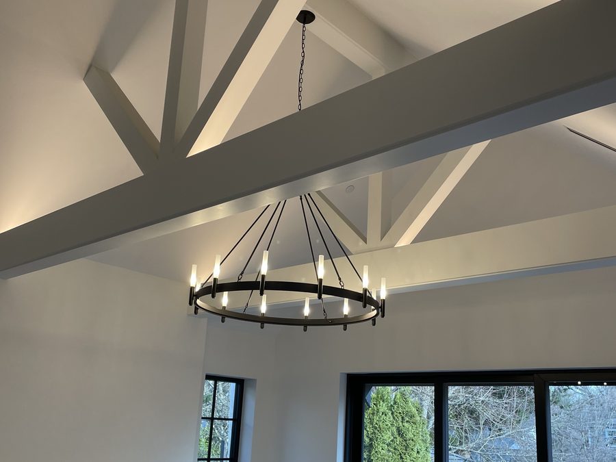 Chandelier and concealed cove lighting, vaulted ceiling