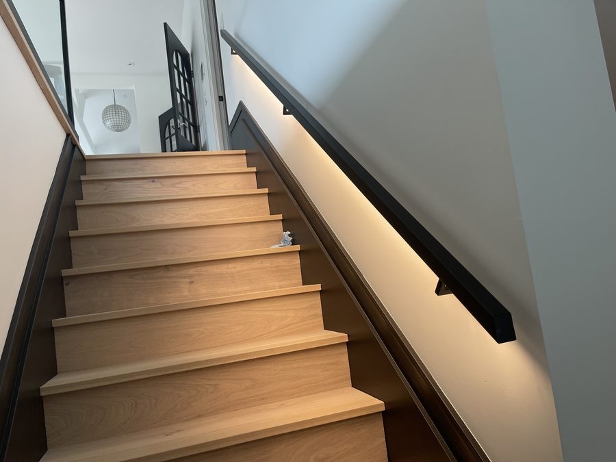 Concealed LED under a stair handrail